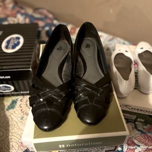 Low wedge heeled black shoes.   Faux Leather.  Barely worn.  Great condition